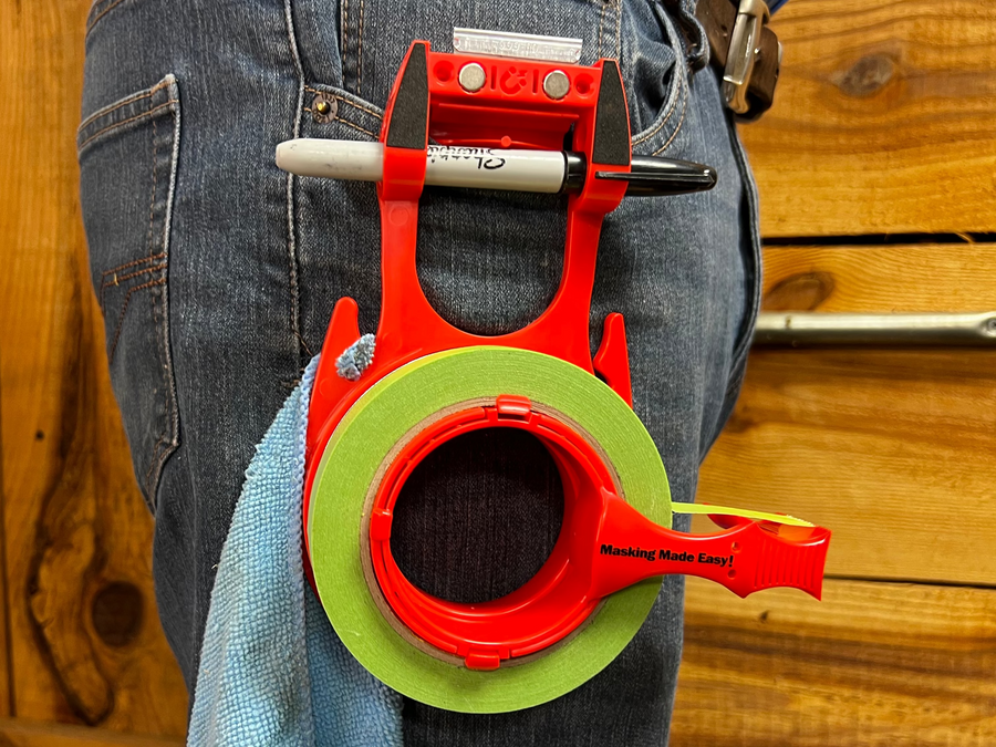 The Tape Caddy Super Pack shown clipped to a painters pant Pocket.